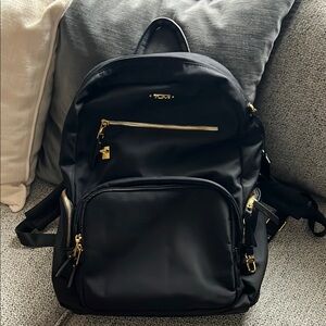 Tumi Black Travel Bag with Gold Accents